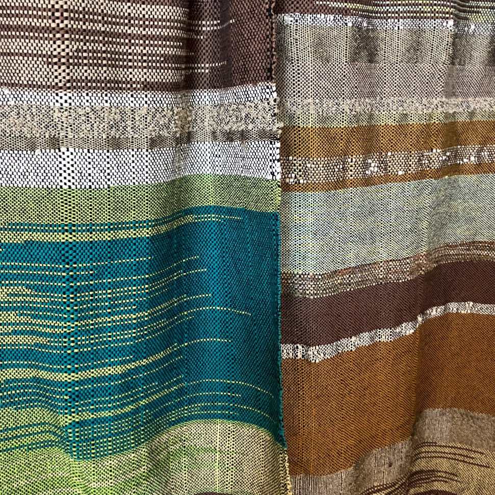 Upclose of panels side by side. Green & brown on the left, brown & tan on the right