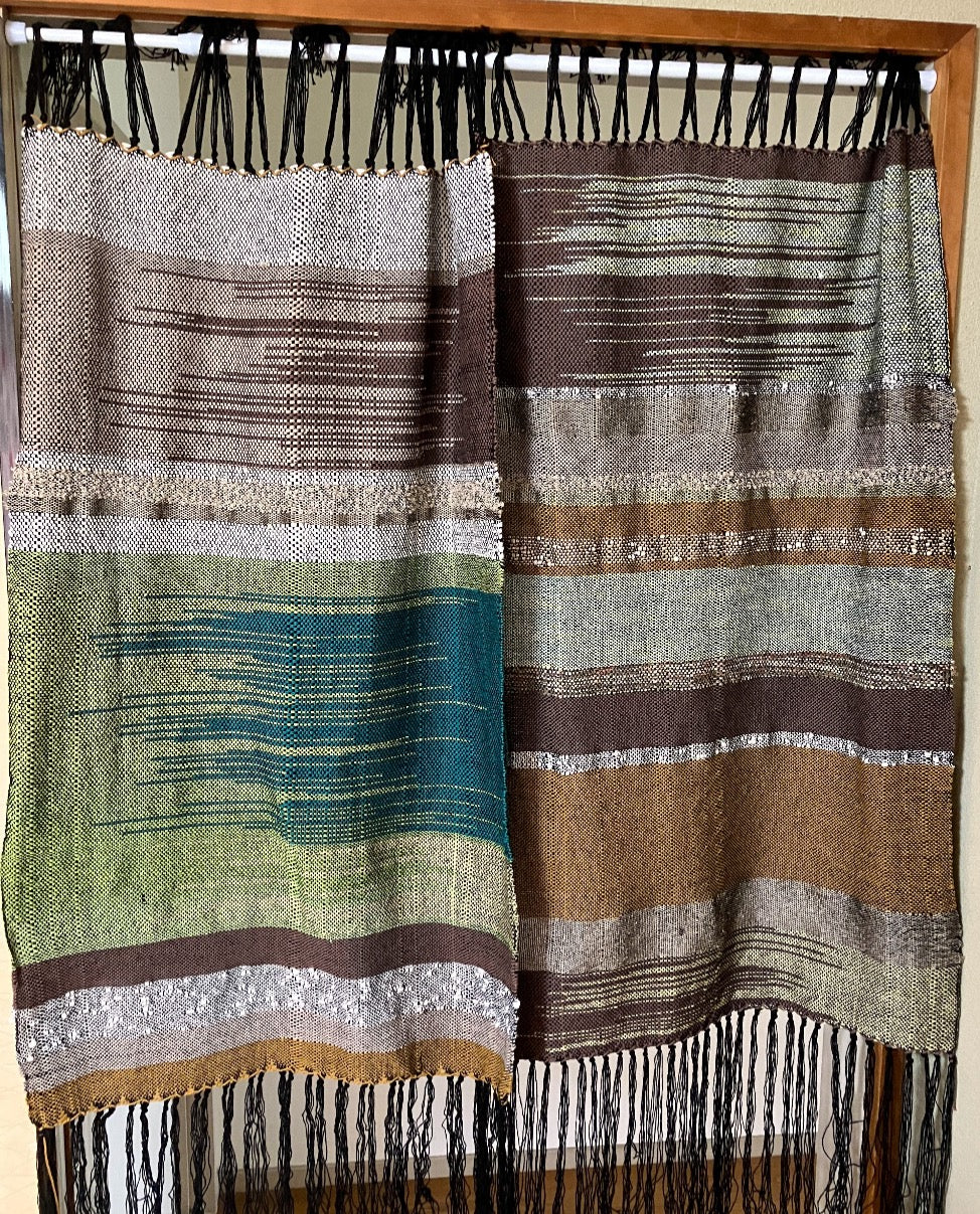 Two curtain panels hang side by side. Green emphasis on left and brown on right
