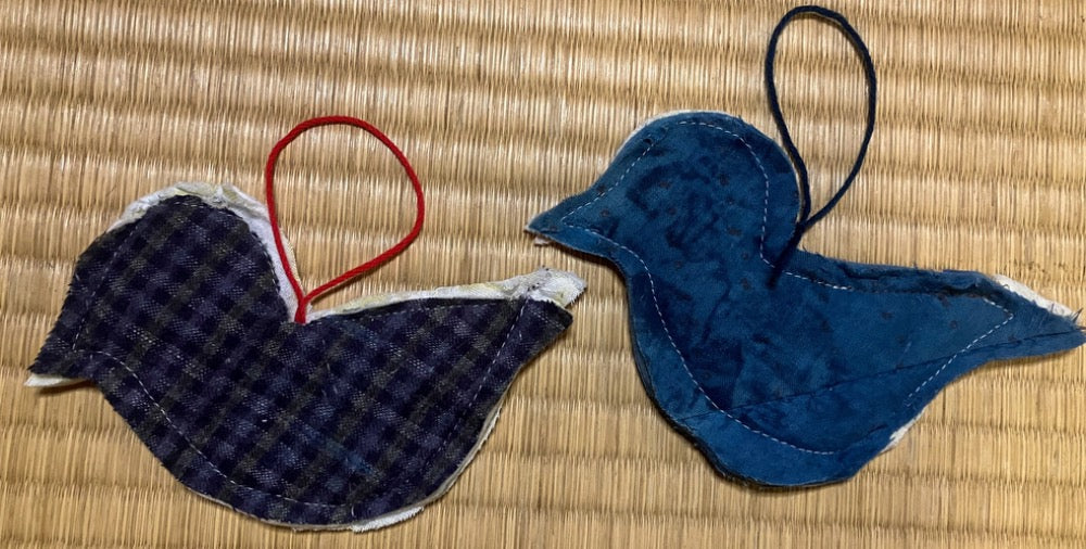 Two quilted bird silhouettes
