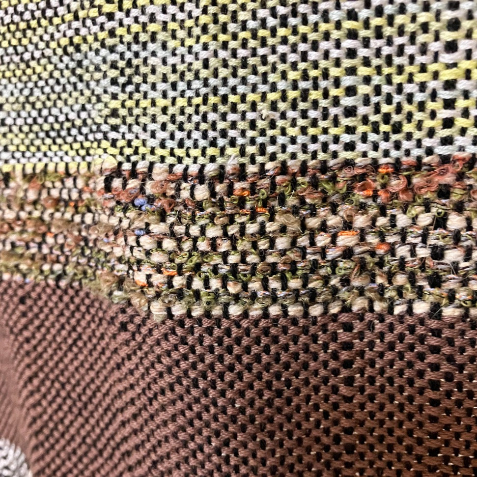 Upclose detail of brown textured yarn of panel