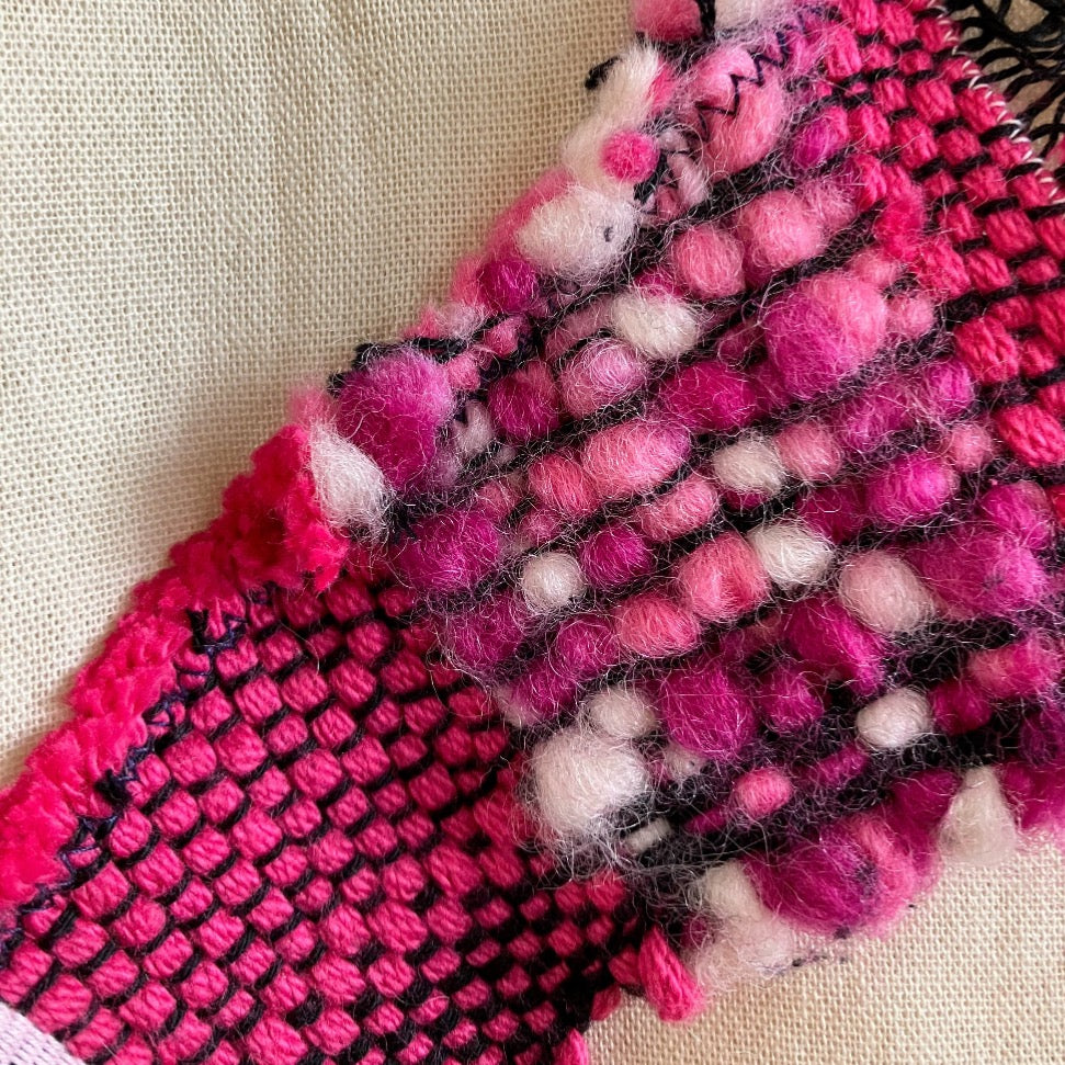 Close up of pink wool  and cotton on beige bag