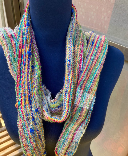 Neatly draped scarf over mannequin