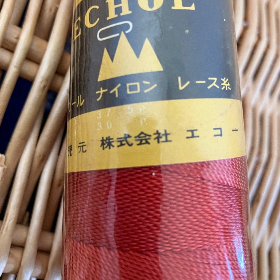 Close up of orange nylon yarn and label in Japanese