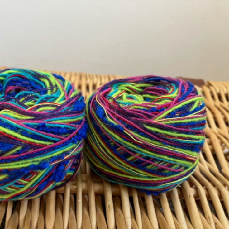 two balls of mixed blue+pink+purple+green yarn