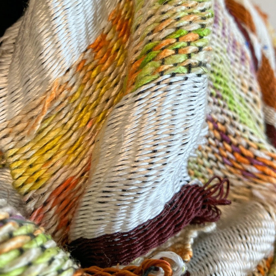 Up close detail of brown and cream silk shawl